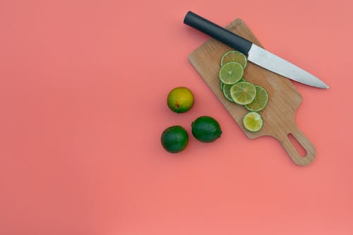 Slices of Lime Fruit on a Chopping Board