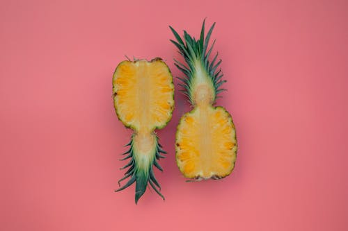 A Sliced Pineapple on a Pink Surface