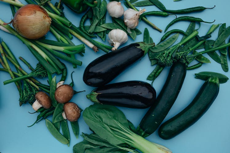 A Mixed Vegetables On A Blue Surface