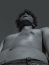 Grayscale Photo of a Topless Man