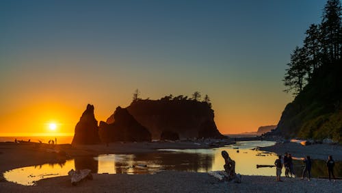 People on the Beach during Sunset