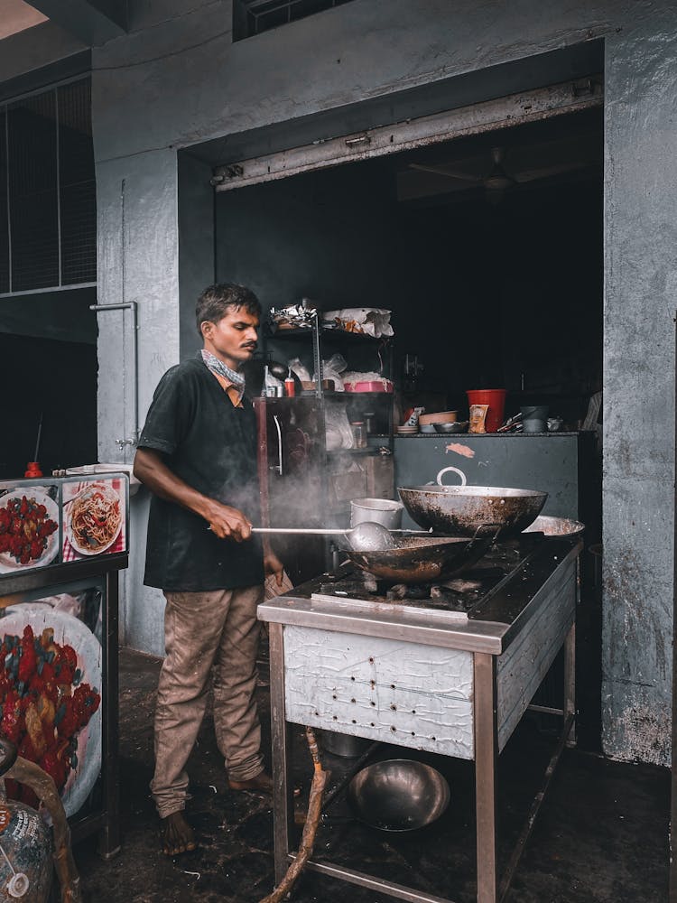 Man Cooking On The Street