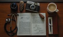Black and Silver Camera on Book Page