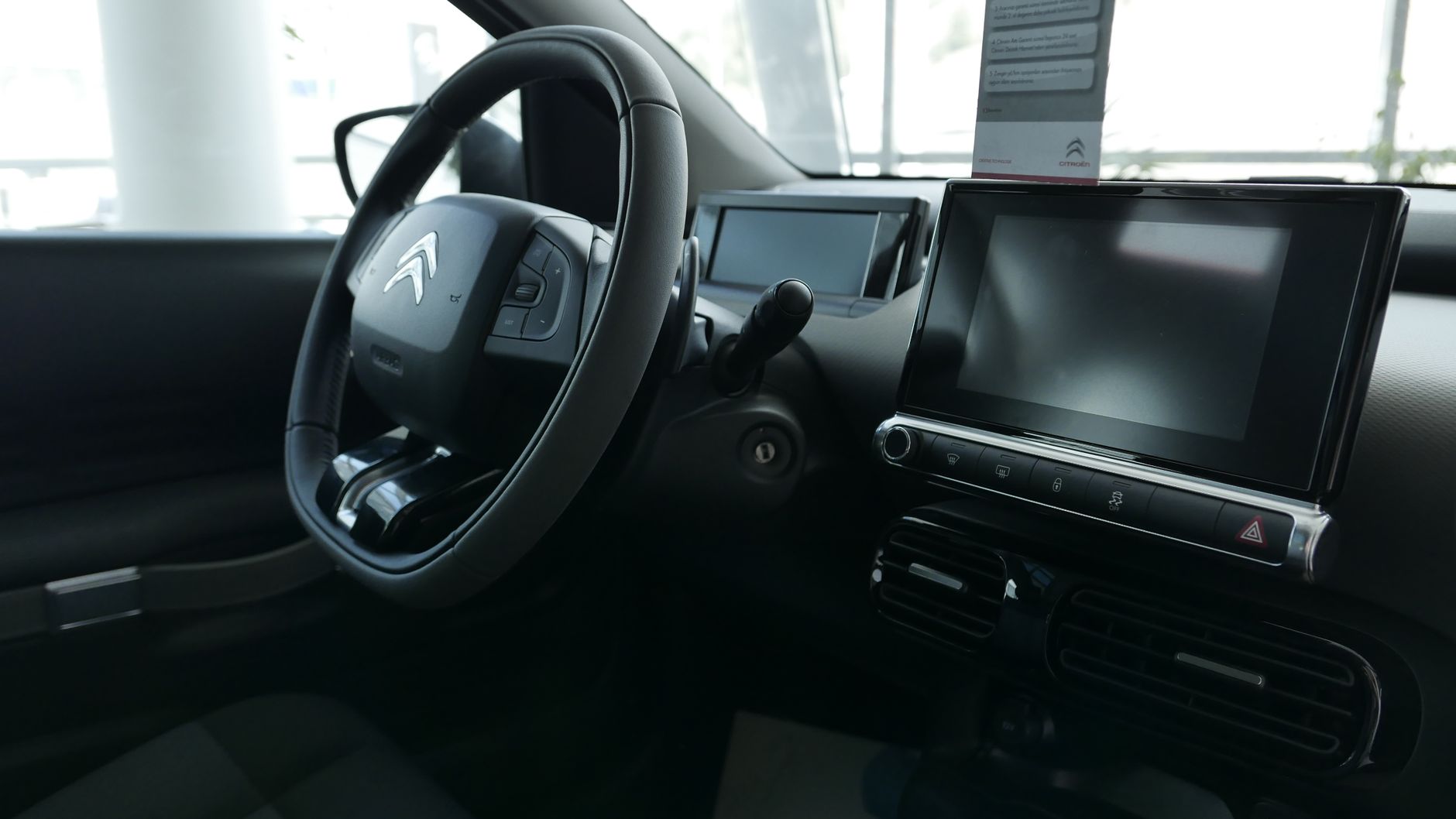 Explore the modern design and features of a Citroen car's dashboard and steering wheel.