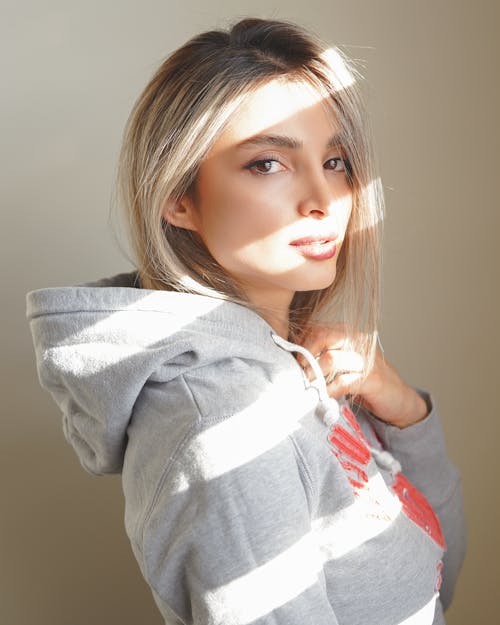 Side View of a Woman in Gray Hoodie