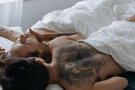 A Couple Lying in Bed Together