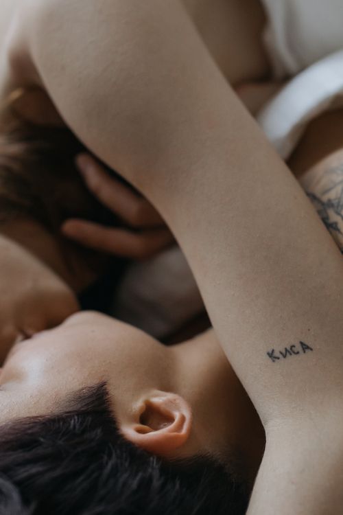 Free Close-up of a couple embracing, showcasing tattoos and intimacy, expressing love and connection. Stock Photo