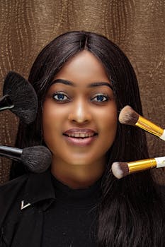 Close-up portrait of a woman with makeup brushes, showcasing beauty and style.