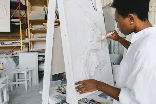 Woman Painting on a Canvas