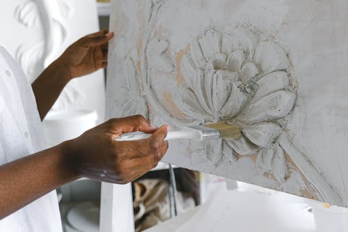 Free A Painter doing Flower Painting Stock Photo