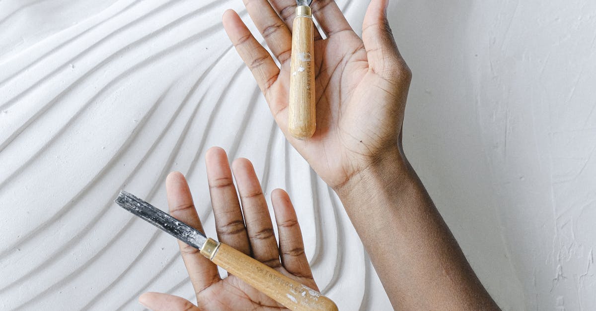 Person Holding Chisels · Free Stock Photo