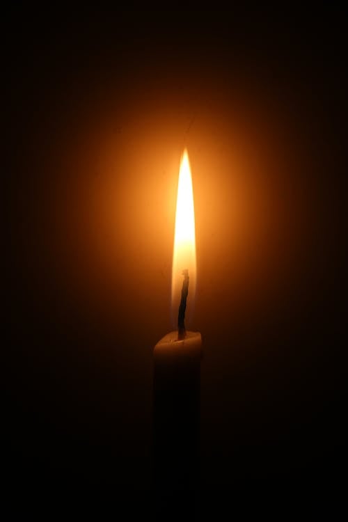 Free Candle Light in Darkness Stock Photo