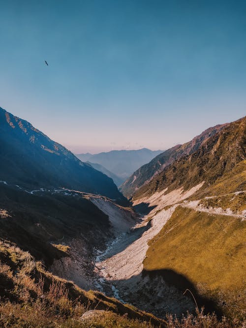 A Creek in the Valley Between Mountains