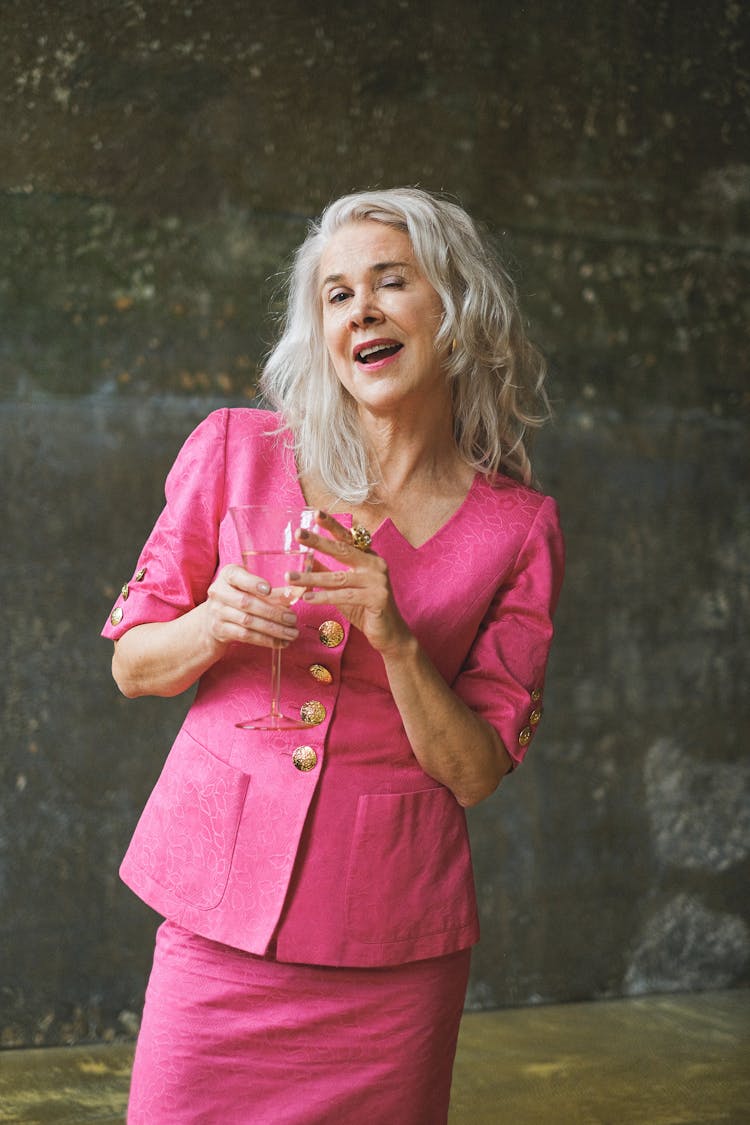 Photo Of A Woman With Gray Hair Winking