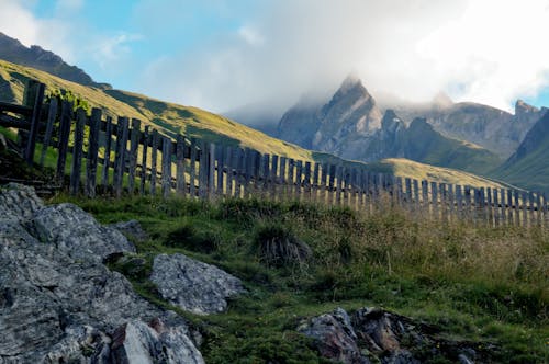 Free Brown Wooden Fence Beside Mountain Stock Photo