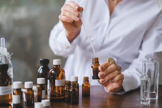 Selective Focus Photo of Dropper and Amber Bottles 