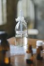 Clear Glass Bottle on Brown Wooden Table