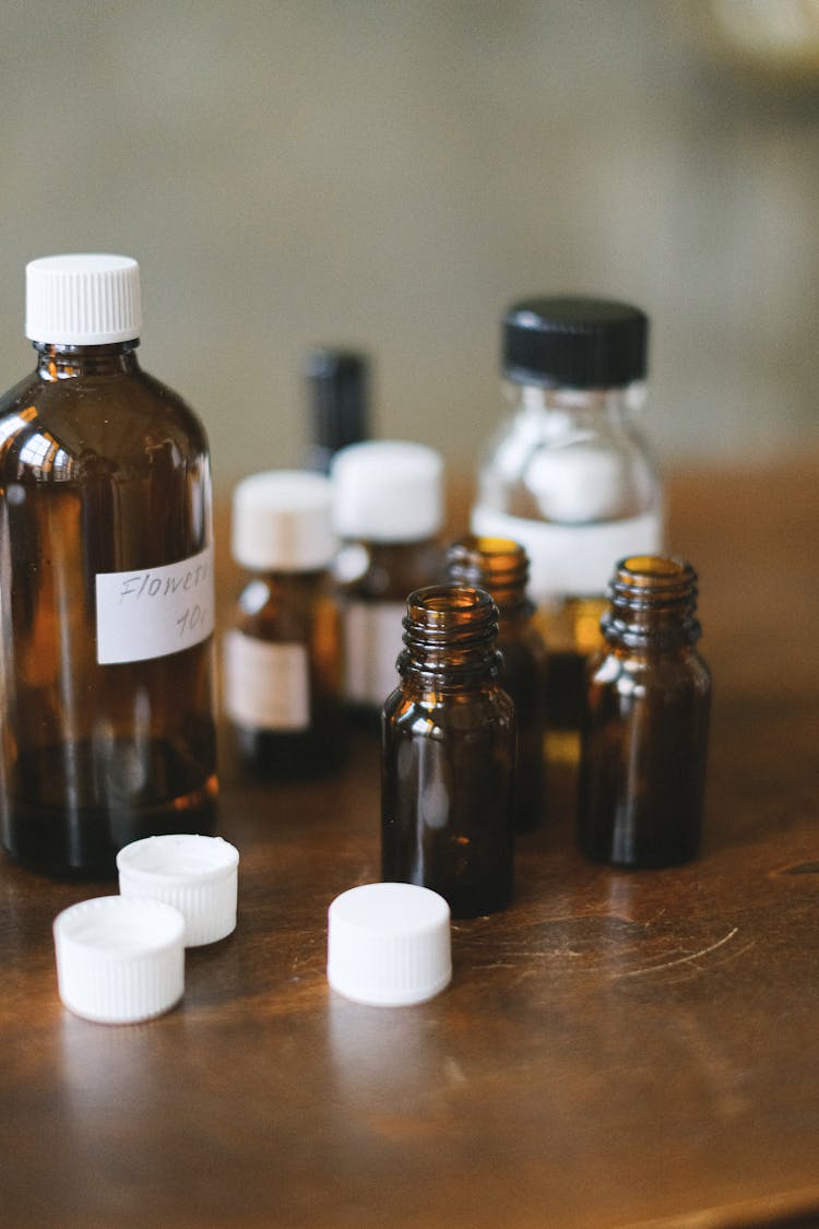 Pharmacy Glass Bottles On A Wooden Table