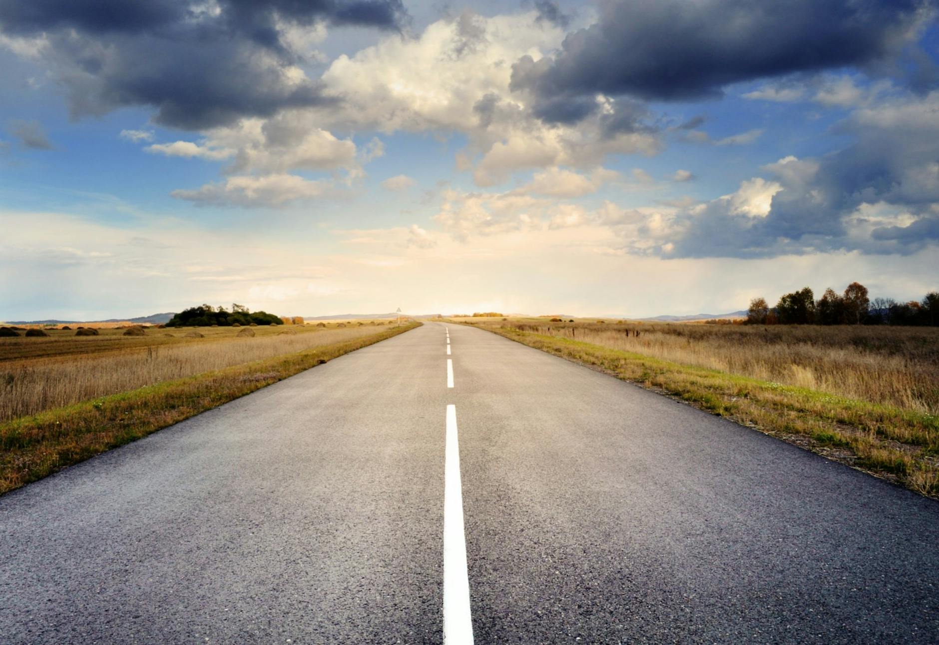 Asphalt Road Under Cloudy Sky