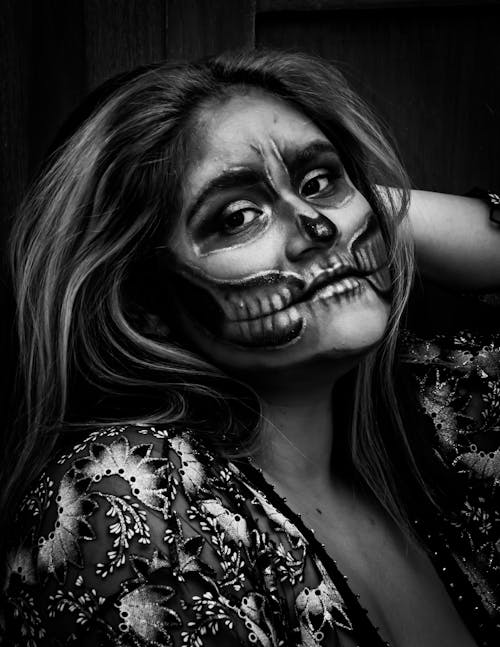 Grayscale Photo of Woman With Face Paint