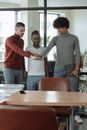 Men in the Office Standing While Hands Together