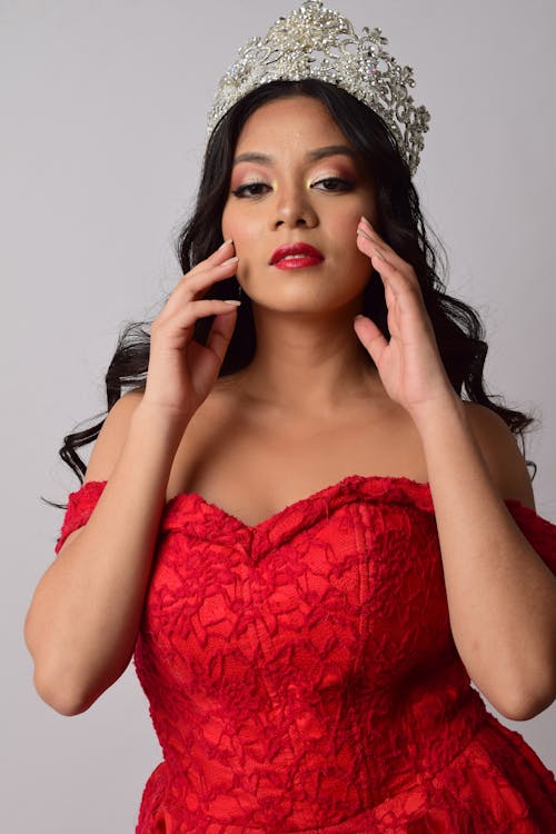 Woman in Red Floral Lace Gown Posing
