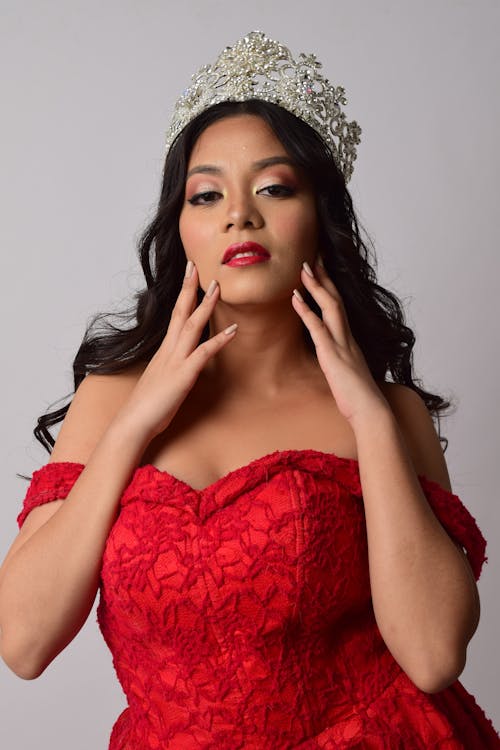 Woman Wearing Crown and Red Gown Dress