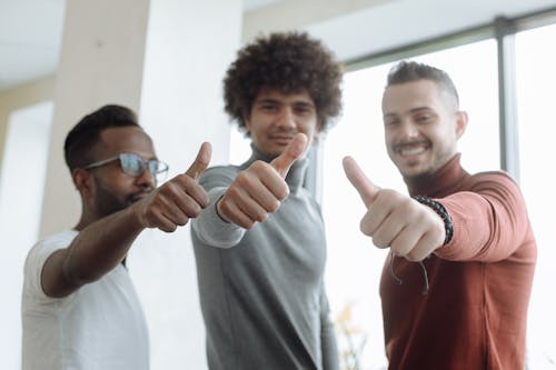 Free Men Putting a Thumbs Up Stock Photo