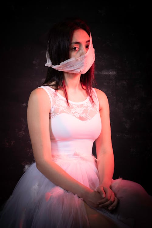 Woman with Bandage over her Mouth 