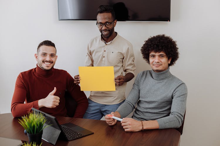 Office Team Smiling At The Camera