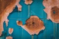 Old Blue Paint Peeling Off Wooden Surface