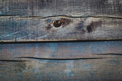 Free Rustic and textured close-up of weathered wooden planks, ideal for backgrounds or design projects. Stock Photo