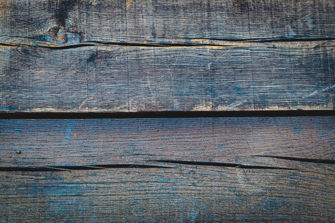 close up of rustic weathered wooden planks with visible grain and text