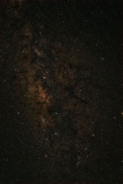 Free A mesmerizing view of the star-filled night sky featuring the Milky Way galaxy. Stock Photo