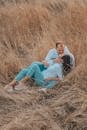 Sweet Couple on Brown Grass Field