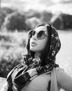 Woman with Scarf Wearing Sunglasses