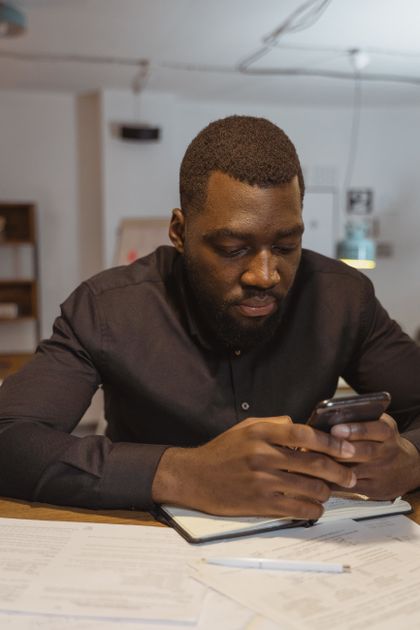 Man at a desk with a phone