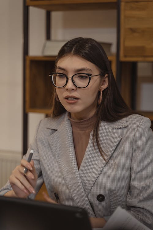 Woman in Gray Blazer Wearing Black Framed Eyeglasses