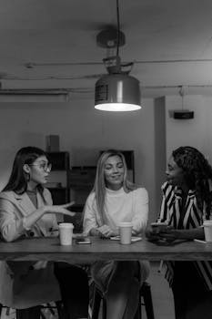 Three diverse businesswomen engaged in a collaborative meeting
