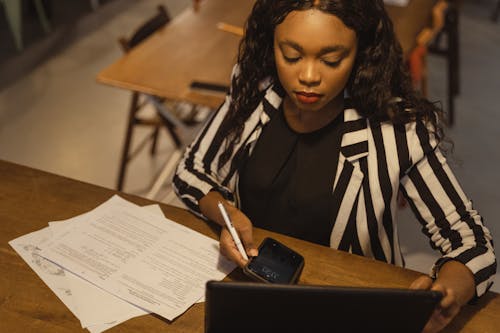 Free A Businesswoman Working at an Office Stock Photo