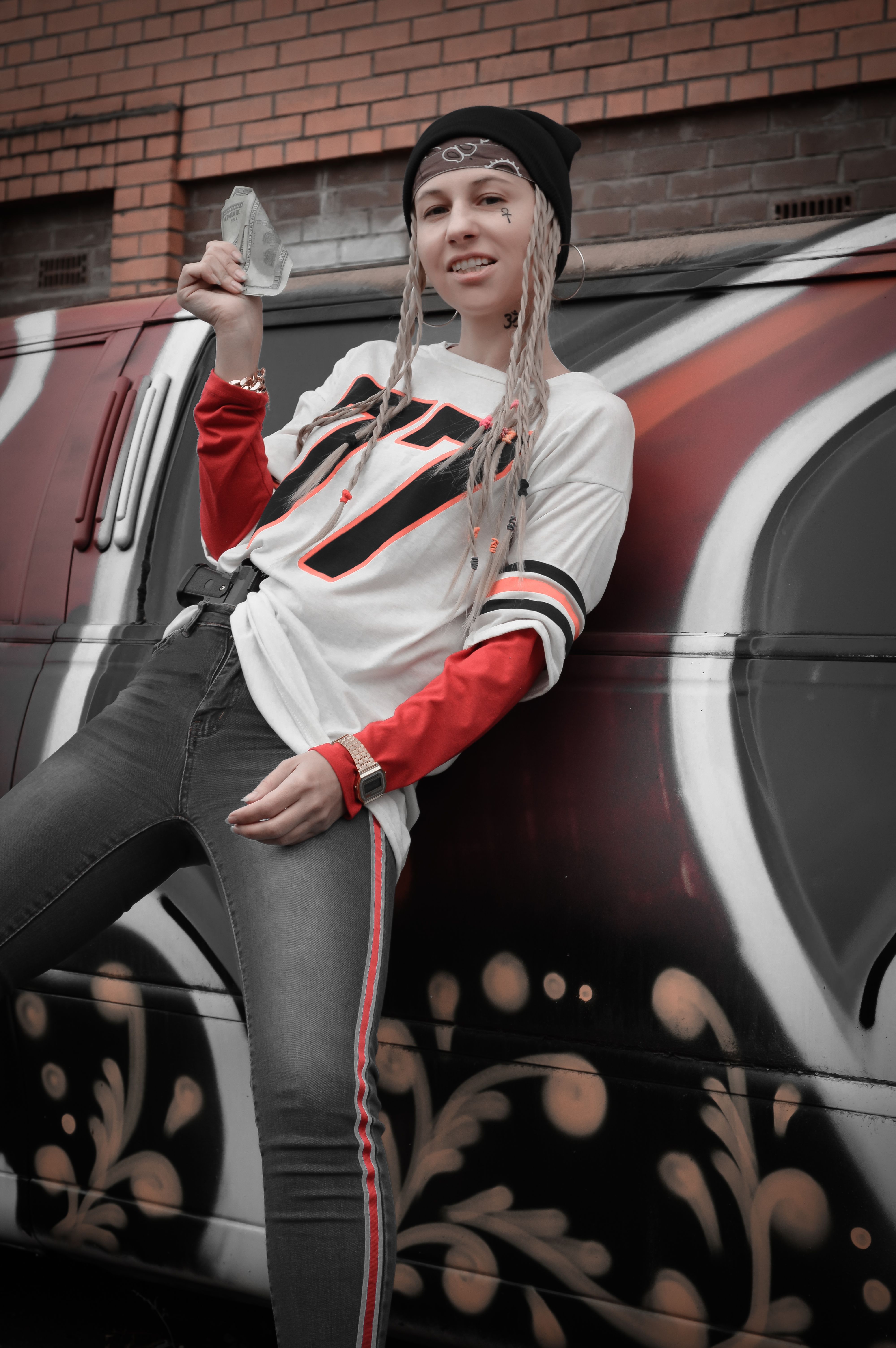 Woman in Long Sleeve Shirt Leaning on a Vehicle · Free Stock Photo