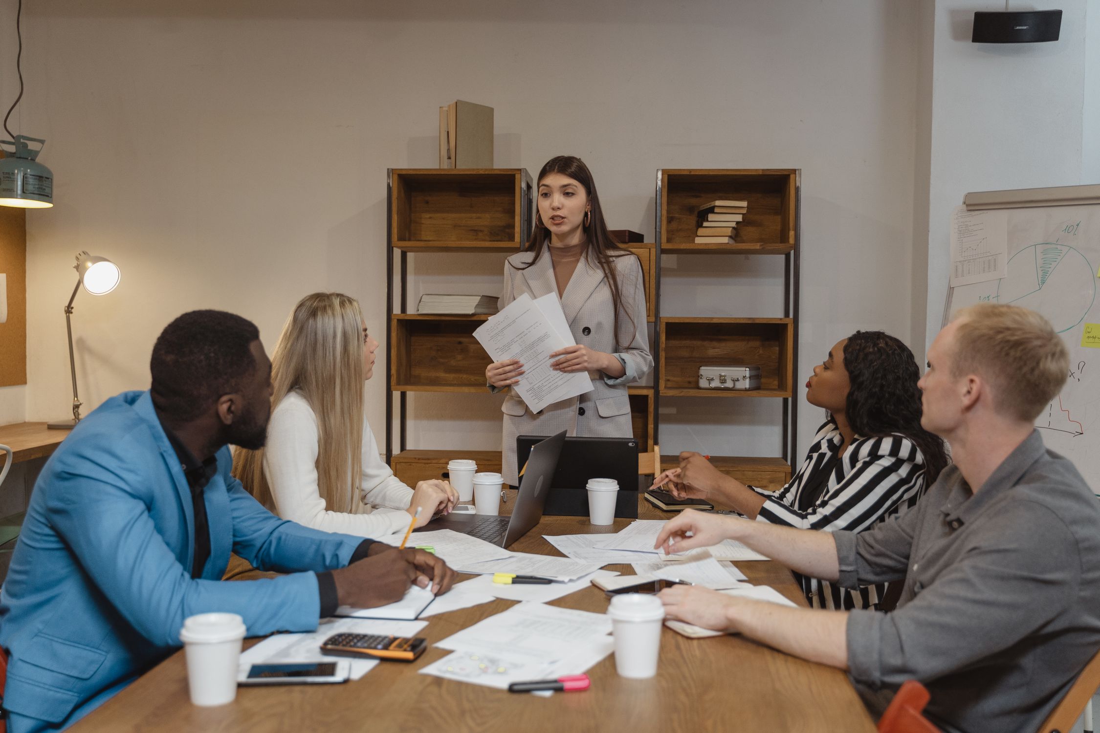 Someone One Reporting Woman in Gray Blazer Doing a Report · Free Stock Photo