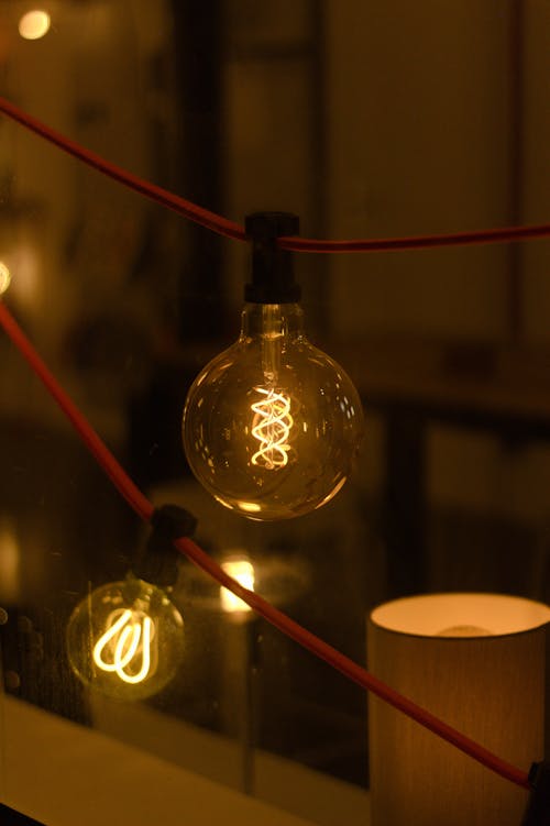 A Hanging Light Bulb in Close-Up Photography