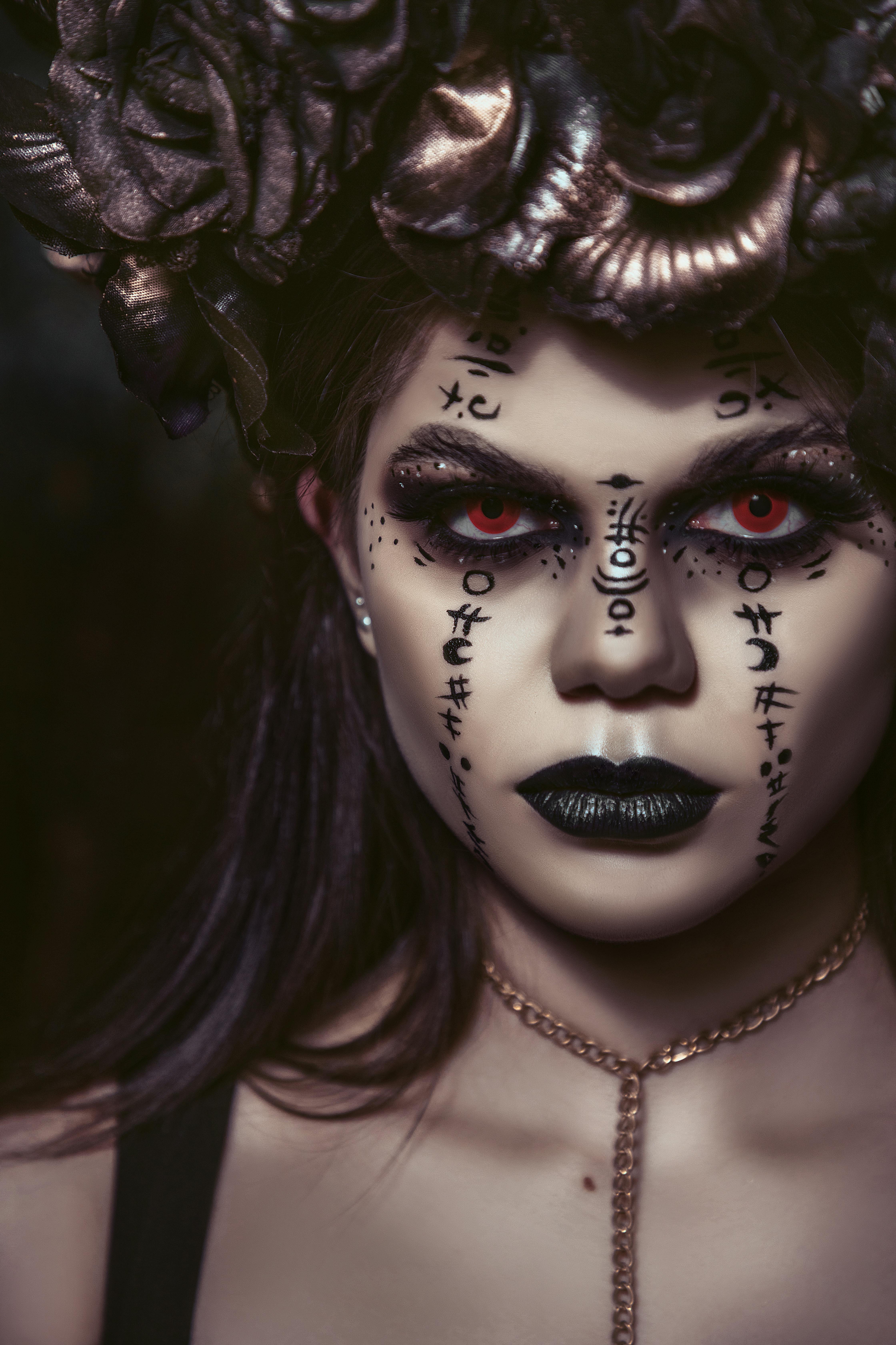 spooky woman with makeup of spells