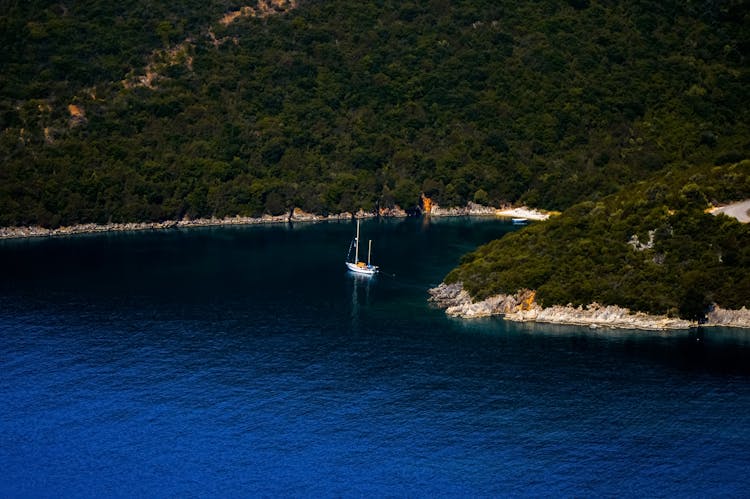 White Sailboat On Blue Sea