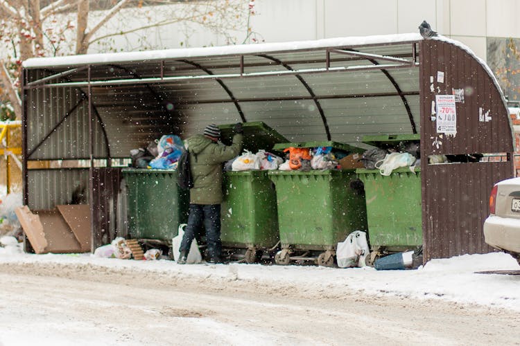 Man Throwing Away Trashes