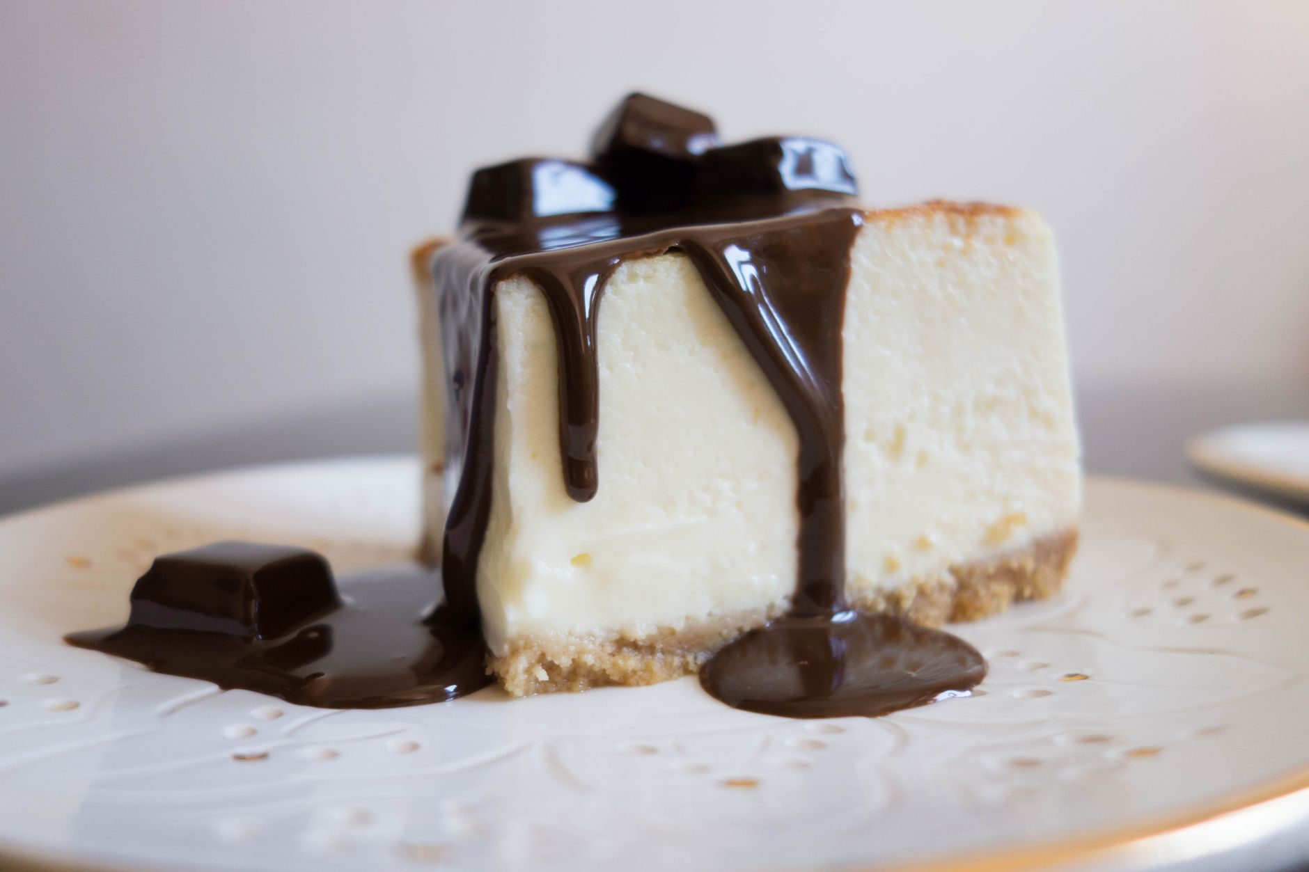 Slice of creamy eggless chocolate cheesecake served on a plate