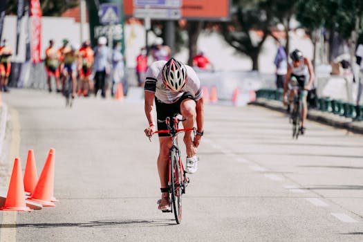 A competitive cyclist in an urban race bending forward, showcasing endurance and speed.