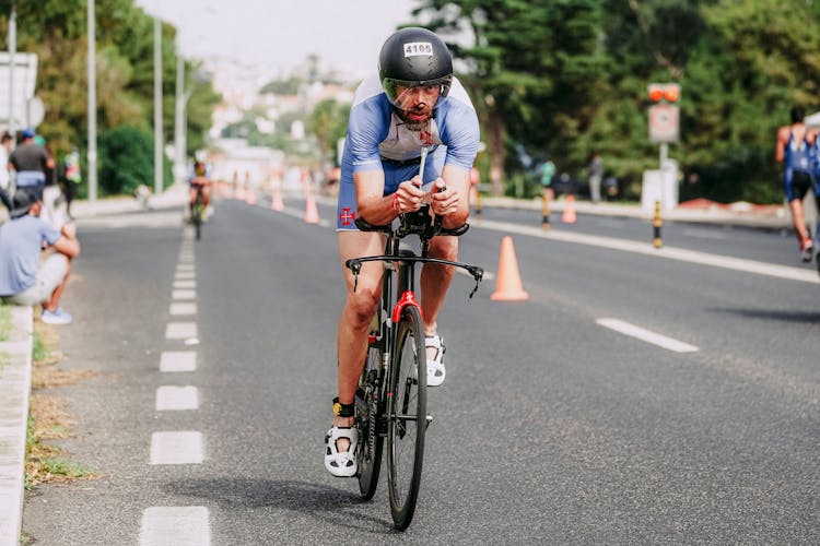 Serious Man Riding Bicycle On Track