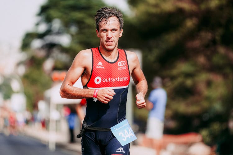 Tired Strong Sportsman Running Marathon On Track